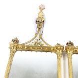 A pair of Italian carved and gilded gesso-framed wall mirrors, with gilded verre eglomise inset