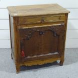 A French cherrywood cupboard, with frieze drawer and carved panelled cupboard below, width 2'10",