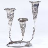 A Chinese silver table epergne, with relief embossed dragon decoration and floral leaf base, by Wang