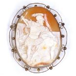A large relief carved cameo panel brooch, depicting Theseus slaying the Centaur, in unmarked