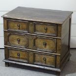 An 18th century oak chest of 3 long drawers, of small size, with moulded panelled drawer fronts,
