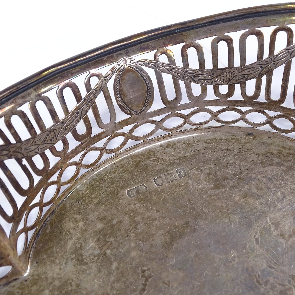 A George V oval silver fruit bowl, with scrolled handles, pierced sides with engraved Adams style - Image 3 of 3