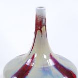 A modern Chinese porcelain narrow-necked vase with red streak glaze, marks under base, height 30cm