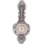 A small silver banjo-shaped barometer / thermometer, with pierced foliate surround, by Henry