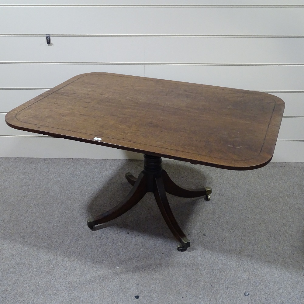 A 19th century mahogany tilt-top breakfast table, on quadruple splay leg base, 4'10" x 3'5" - Image 4 of 4