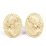 A pair of Victorian relief carved ivory cameo earrings, depicting female portraits, with sterling