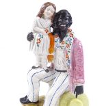 A Staffordshire figure of Uncle Tom, height 27cm