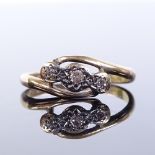 An unmarked gold 3-stone diamond crossover ring, setting height 6.3mm, size J, 1.4g