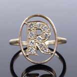 An unmarked gold and diamond initial R panel ring, setting height 16mm, size H, 2.3g