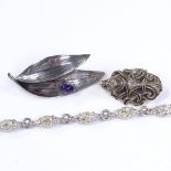 A Viking revival sterling silver brooch, by Frans Magnussen, a Swedish silver and amethyst leaf