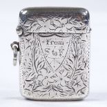 An unusual silver Vesta case/stamp case, with all over floral engraved decoration, by Henry