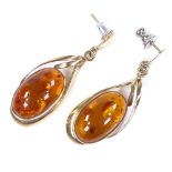 A pair of unmarked gold and amber drop earrings, with stud fittings, height excluding fitting 29.