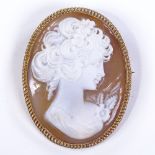 A relief carved cameo panel brooch, depicting female bust, in 9ct gold rope twist frame, brooch