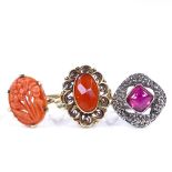 A 14ct gold carnelian dress ring, size M, a 9ct carved coral panel ring, size M, and a silver