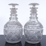 A pair of 19th century cut-glass decanters with neck rings and mushroom stoppers, height 24cm
