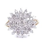 A 9ct gold diamond cluster snowflake ring, total diamond content approx 0.75ct, setting height 15.