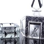 A Czechoslovakian Art Deco cut-glass perfume bottle and stopper, with black painted geometric bands,