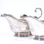 A pair of Scottish silver sauce boats, with reeded rims and C-handles, by Hamilton & Inches,