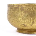 An Islamic gilded brass bowl with engraved decoration, diameter 19cm
