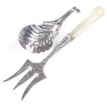 An unmarked Georgian silver tea leaf caddy spoon, length 8cm, together with a silver and mother-of-