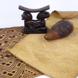 A group of Tribal items, including 2 textile panels, a carved hardwood neck rest, and a geometric