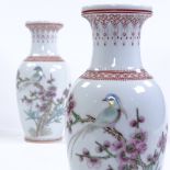 A pair of Chinese Republic porcelain vases, hand painted birds and blossom, height 21cm