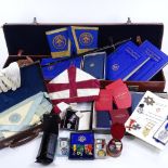 A large collection of Masonic regalia, including several silver and enamel jewels, gold braid