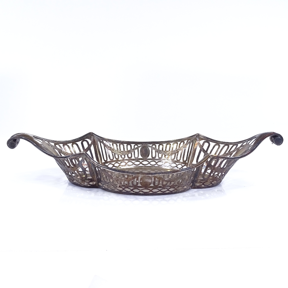 A George V oval silver fruit bowl, with scrolled handles, pierced sides with engraved Adams style - Image 2 of 3