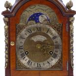 A walnut-cased dome-top mantel clock in Georgian style, with brass mounts, moon phase dial, and 8-