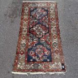 A Caucasian geometric design rug, 6'2" x 3'2"