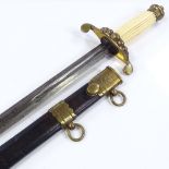 A Royal Navy midshipman's dirk, brass-mounted hilt, with brass-mounted leather scabbard, length 50cm