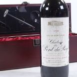 A bottle of 1986 Chateau Pont du Roy, Cotes de Bourg, in presentation box