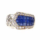 An 18ct gold sapphire and diamond buckle ring, set with calibre-cut sapphires and princess