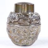 An Edwardian silver baluster tea caddy, with relief embossed floral decoration, by Pairpoint
