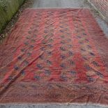 A large Antique red and blue ground Persian carpet, 16'4" x 11'4"