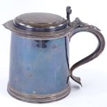 A George V Britannia Standard silver lidded tankard, of plain cylindrical form with reeded foot,