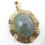 A 9ct gold cabochon jade panel pendant, with frilled pierced surround, pendant height excluding bale