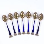A set of 7 Danish sterling silver-gilt and blue enamel coffee spoons, with crown terminals, by