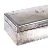 A George V rectangular silver cigarette box, with engine turned decoration, by Stewart Dawson & Co