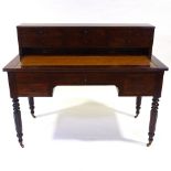 A 19th century mahogany Gillows style writing desk, with 6 drawer fitted upper part, slide out