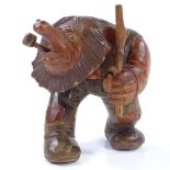 A Tyrolean carved and painted wood man smoking a pipe, height 14cm