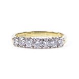 An 18ct gold 7-stone diamond half-hoop ring, total diamond content approx 0.5ct, setting height 3.