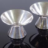 A pair of Swedish silver stylised candlesticks, maker's marks GAB, hallmarks 1957, height 5cm