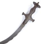 A Middle Eastern curved sword, probably 18th century, with notched blade and steel hilt, length 54cm