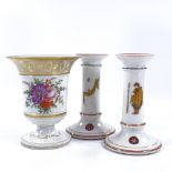 A French porcelain vase with painted botanical study and gilded rim, height 14cm, and a pair of