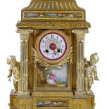 An ornate 19th century French gilt-spelter 3-piece clock garniture, with porcelain urns and