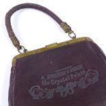A small Victorian leather purse, inscribed "a present from the Crystal Palace", width 13cm