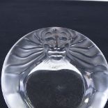 A Rene Lalique moulded glass lion-mask design ashtray with frosted surround, 14.5cm across,