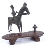 An Indian bronze horse and rider, height 19cm, and an Oriental silver inlaid hardwood shoe (2)