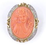 A relief carved coral cameo pendant/brooch, depicting female portrait, in unmarked gold frame,